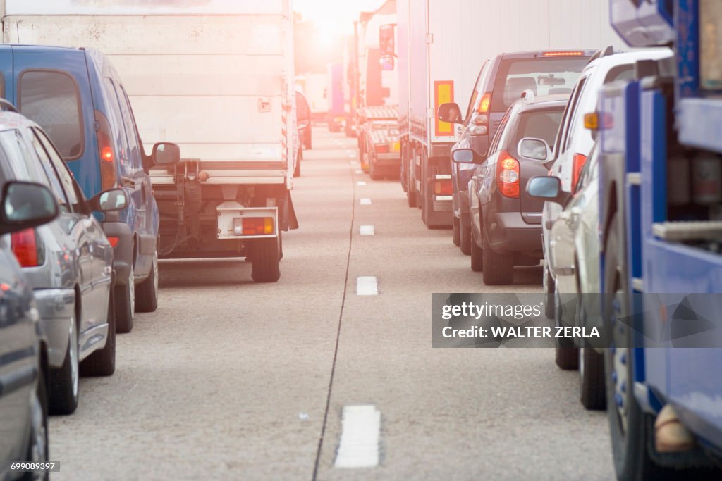 Rear view of rows of traffic queueing on highway