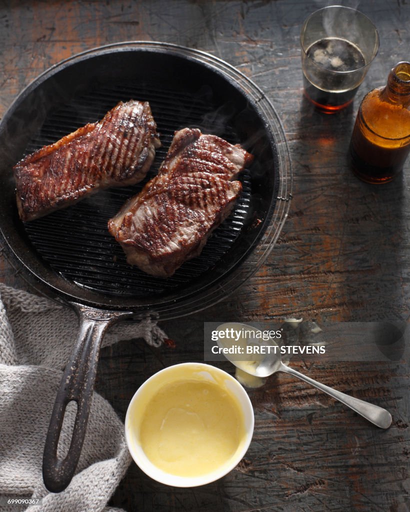 Sirloin steak in frying pan with bearnaise sauce