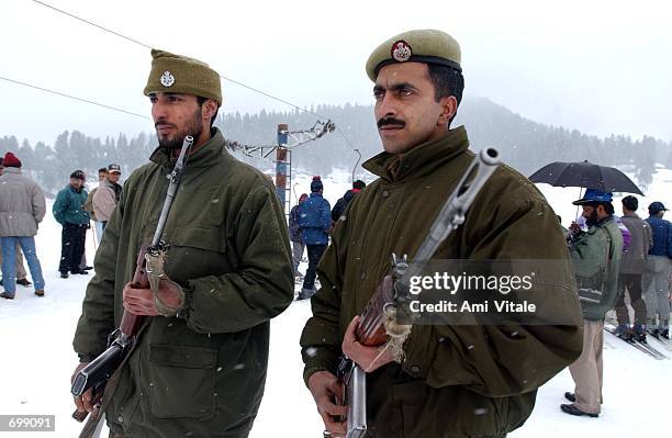 Kashmiri police patrol the skiing area during the Gulmarg Cup February 16 a state skiing championship held in the picturesque skiing resort of...