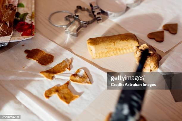 high angle view of pastry cutters and dough at table - national day celebrations in sweden 2016 imagens e fotografias de stock