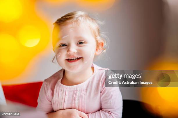portrait of smiling girl sitting at home - national day celebrations in sweden 2016 imagens e fotografias de stock