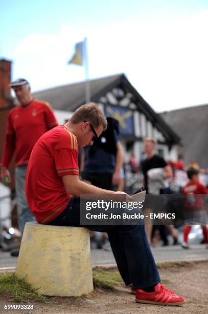 Fans relax on the banks of The River Trent prior to kick off