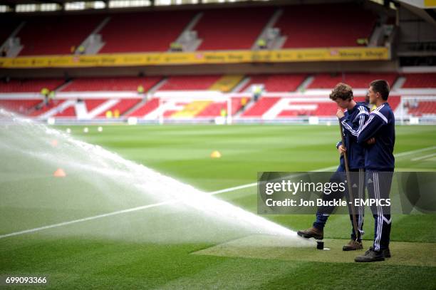 General view of The City Ground as ground staff prepare the pitch