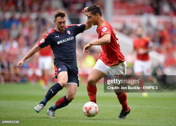 Rotherham United's Lee Frecklington battles for the ball against Nottingham Forest's Tyler Walker