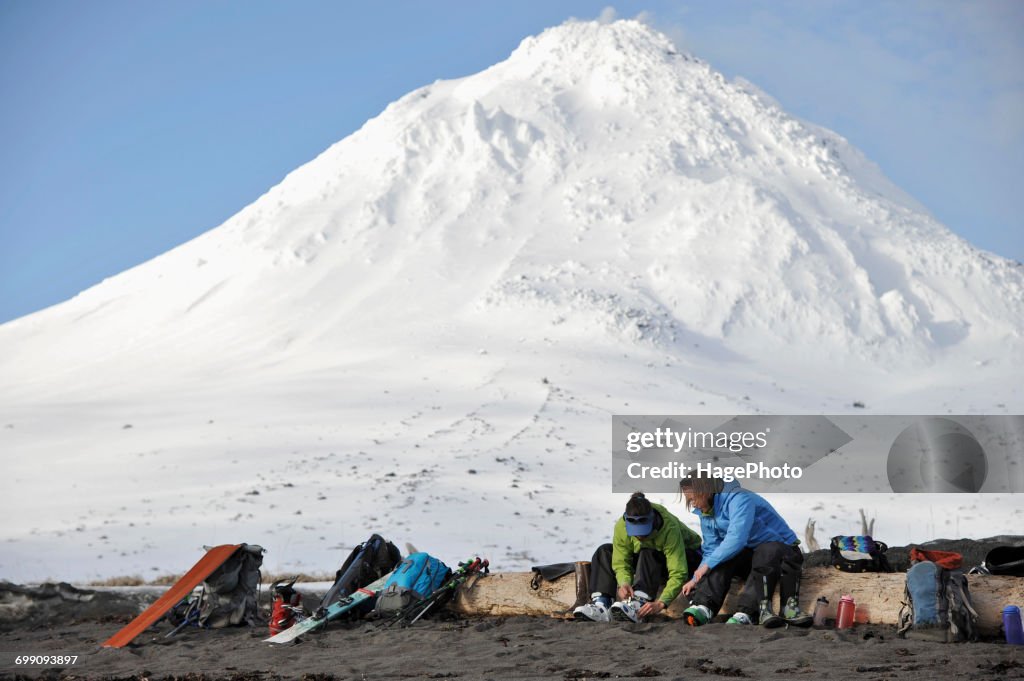 Skiers gear up on the beach of Augustine Island in Cook Inlet