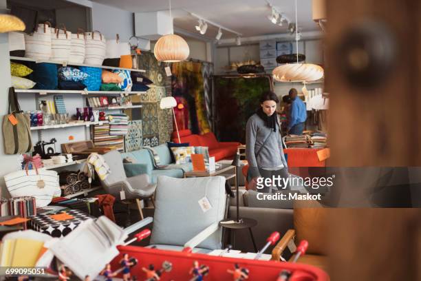 customers looking at furniture in store - sales assistant furniture stock pictures, royalty-free photos & images