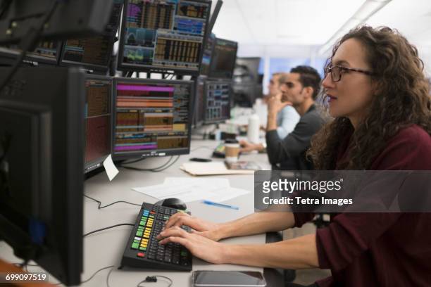 young traders analyzing computer data - trading floor stock pictures, royalty-free photos & images