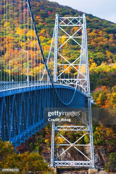 usa, new york, bear mountain with bridge above river - bear mountain bridge stock pictures, royalty-free photos & images