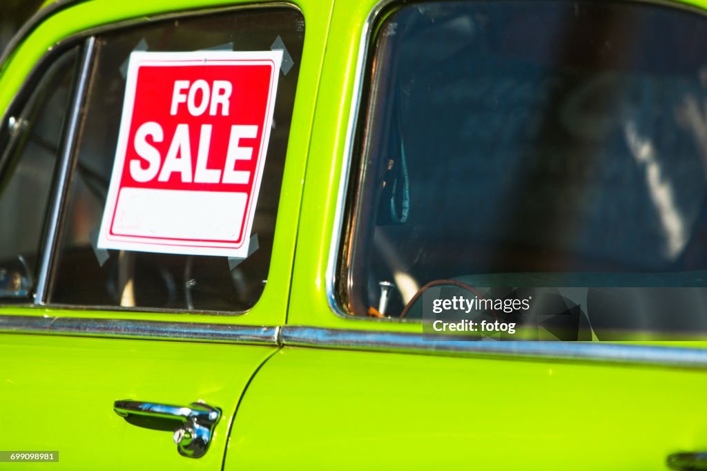 For sale sign on car window