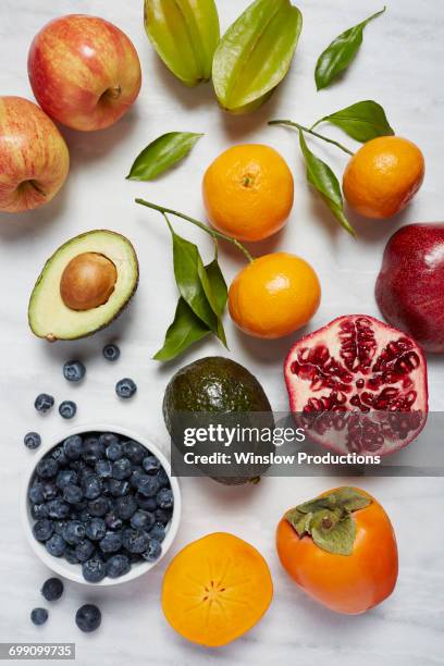 fruits on white surface - fruit bowl stock pictures, royalty-free photos & images