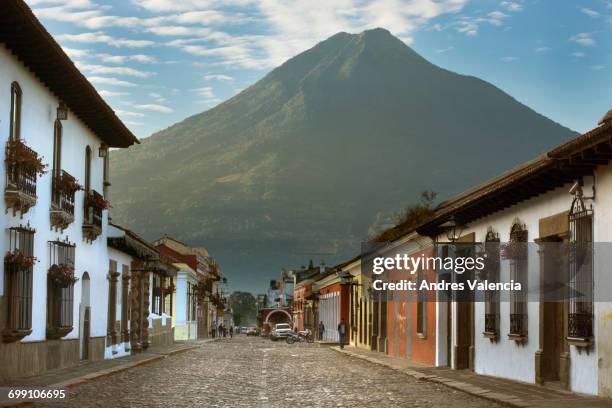 a morning view of the volcn de agua from antigua, guatemala. - agua stock pictures, royalty-free photos & images