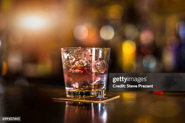 iced drink in tumbler on public house counter - bar glass stock pictures, royalty-free photos & images