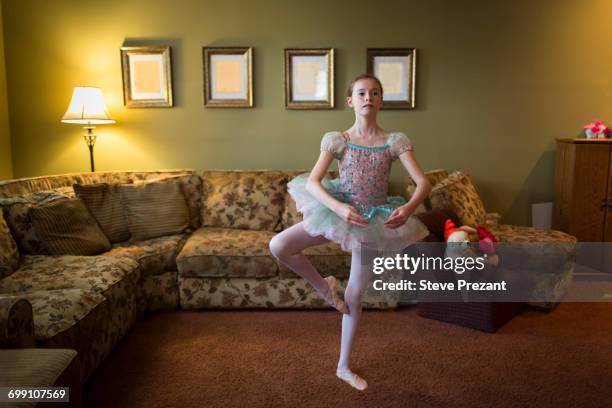 girl in living room ballet dancing - ballet girl stock pictures, royalty-free photos & images