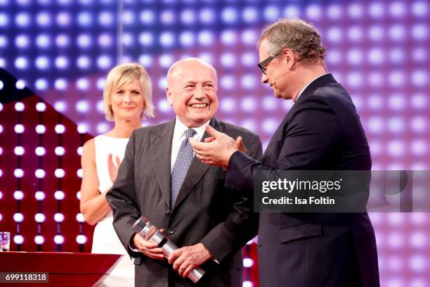 German presenter Barbara Hahlweg, award winner Friedrich von Metzler and Georg Fahrenschon attend the Deutscher Gruenderpreis on June 20, 2017 in...