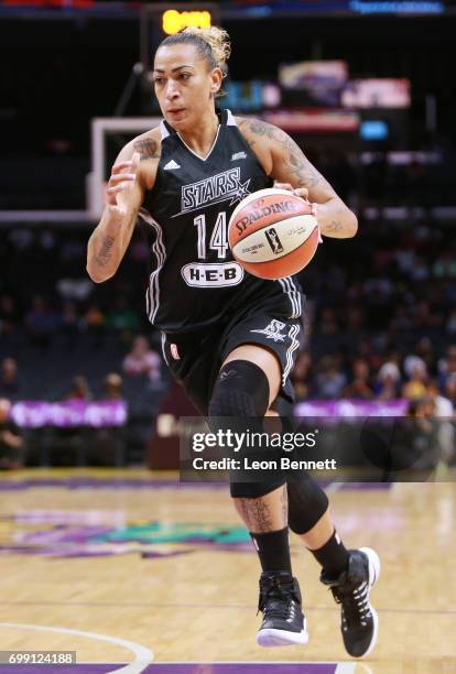 Erika de Souza of the San Antonio Stars handles the ball against the Los Angeles Sparks during a WNBA basketball game at Staples Center on June 15,...