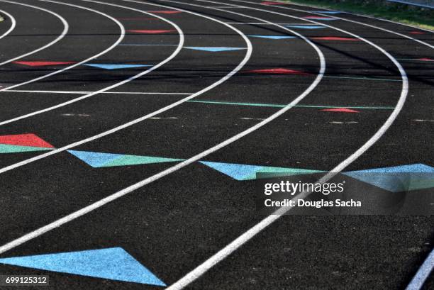 painted dividing lines for runners on the track and field turf - tracciatura stradale foto e immagini stock