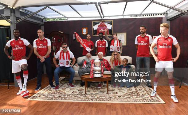 Former Arsenal players Robert Pires and Martin Keown stand on stage to help introduce the new Arsenal Puma Home kit at King's Cross St. Pancras...