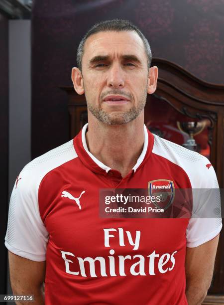 Former Arsenal player Martin Keown poses on stage to help introduce the new Arsenal Puma Home kit at King's Cross St. Pancras Station on June 21,...