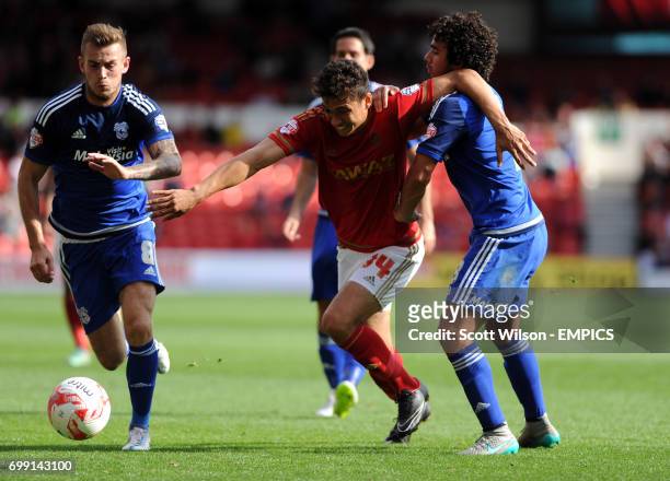 Nottingham Forest's Tyler Walker grapples with and Cardiff's Fabio