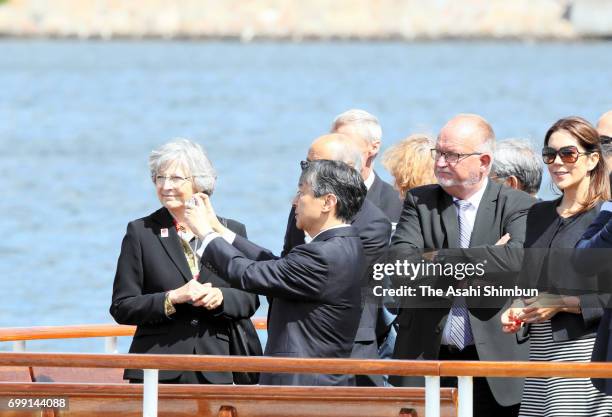 Crown Prince Naruhito takes photographs while cruising around Copenhagen Harbour with Crown Princess Mary of Denmark on June 20, 2017 in Copenhagen,...