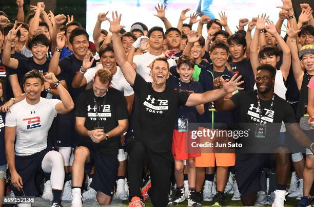 New England Patriots NFL quarterback Tom Brady and his son Jack Brady attend the phtocall during the Under Armour 2017 Tom Brady Asia Tour at Ariake...