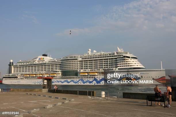 Picture taken on June 20, 2017 in Le Havre shows the Aida Prima cruise vessel, operated by the German cruise line AIDA Cruises, leaving the port. /...