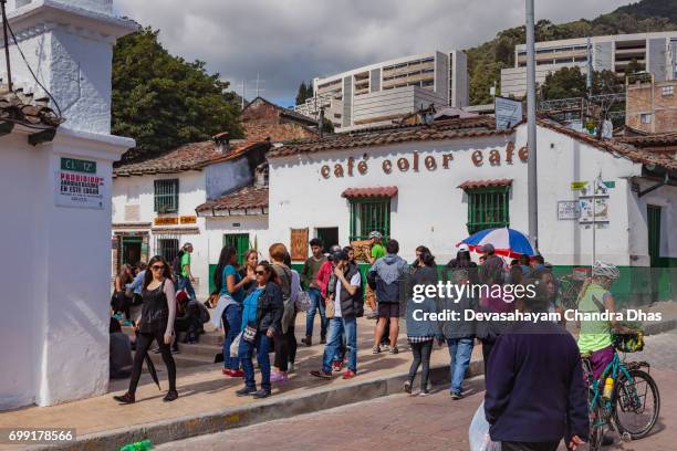 bogota, colombia - local colombian people enjoying the sunshine on plaza chorro de quevedo - plaza del chorro de quevedo stock pictures, royalty-free photos & images