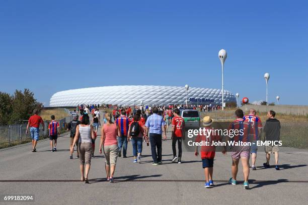 Fans make their way to the Allianz Arena for the match