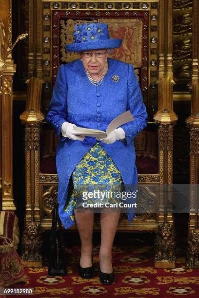 Queen Elizabeth II makes a speech at the State Opening Of Parliament in the House of Lords on June 21, 2017 in London, England. This year saw a...