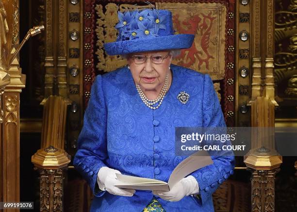 Britain's Queen Elizabeth II delivers the Queen's Speech during the State Opening of Parliament in the Houses of Parliament in London on June 21,...