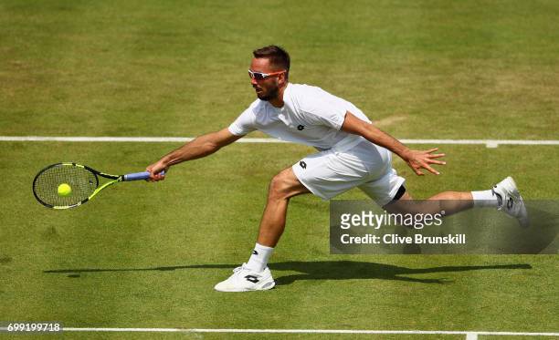 Viktor Troicki of Serbia plays a forehand during mens singles second round match against Donald Young of The United States on day three of the 2017...