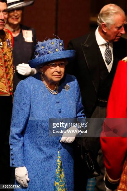 Britain's Queen Elizabeth II and Britain's Prince Charles, Prince of Wales arrive at the Palace of Westminster and the Houses of Parliament from the...