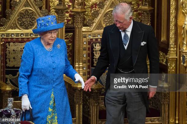 Queen Elizabeth II and Prince Charles, Prince of Wales attend the State Opening Of Parliament in the House of Lords at the Palace of Westminster on...