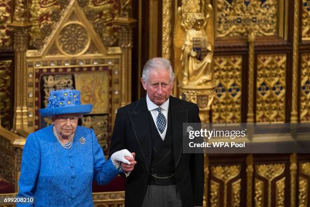 Queen Elizabeth II and Prince Charles, Prince of Wales attend the State Opening Of Parliament in the House of Lords at the Palace of Westminster on...