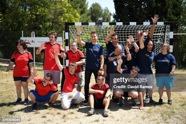 MotoGP rider and new Laureus Ambassador Jorge Lorenzo of Spain poses for a group picture after playing a football match at the Jeroni de Moragas...