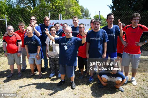 MotoGP rider and new Laureus Ambassador Jorge Lorenzo of Spain poses for a group picture after playing a football match at the Jeroni de Moragas...