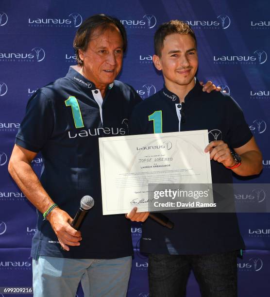 President of Laureus Spain Gabriel Masfurroll and MotoGP rider and new Laureus Ambassador Jorge Lorenzo of Spain pose for the media at the Jeroni de...