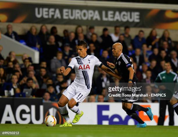 Tottenham Hotspur's Erik Lamela it tackled by Qarabag's Richard Almeida