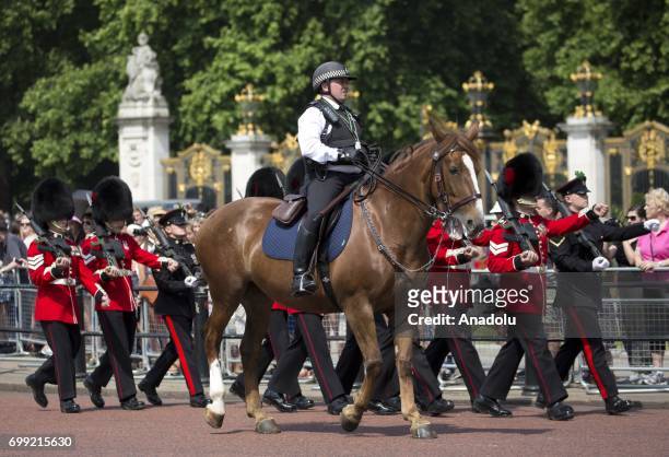 Police presence outside Buckingham Palace ahead of the departure of Britain's Queen Elizabeth II to the Houses of Parliament to address the State...