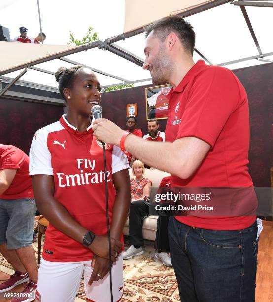 Danielle Carter of Arsenal Ladies on stage as she helps introduce the new Arsenal Puma Home kit at King's Cross St. Pancras Station on June 21, 2017...