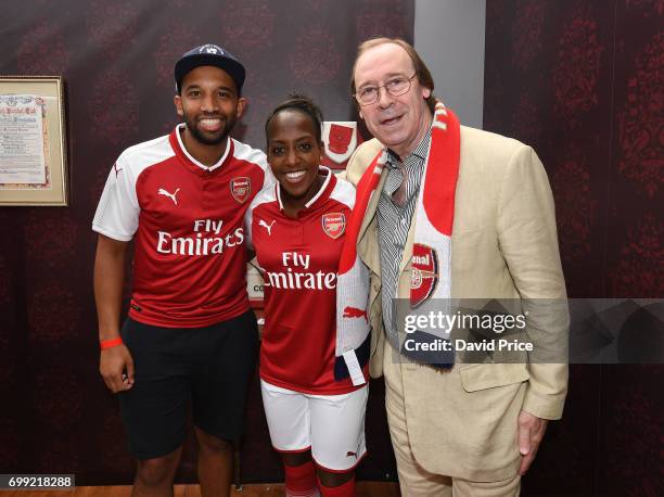 Danielle Carter of Arsenal Ladies and Former Arsenal player Charlie George pose with DJ Charlesy during new Arsenal Puma Home kit launch at King's...