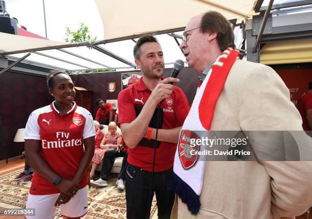 Danielle Carter of Arsenal Ladies and Former Arsenal player Charlie George on stage as they help introduce the new Arsenal Puma Home kit at King's...