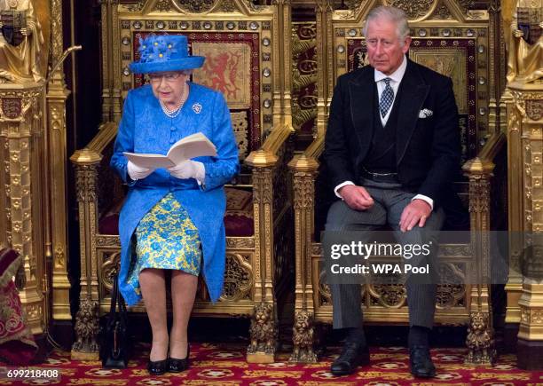 Queen Elizabeth II delivers the Queen's Speech whilst sat next to Prince Charles, Prince of Wales during the State Opening of Parliament in the House...