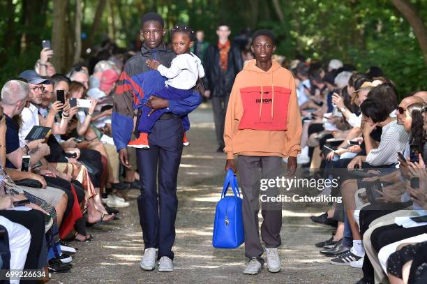 Models walk the runway at the Balenciaga Spring Summer 2018 fashion show during Paris Menswear Fashion Week on June 21, 2017 in Paris, France.