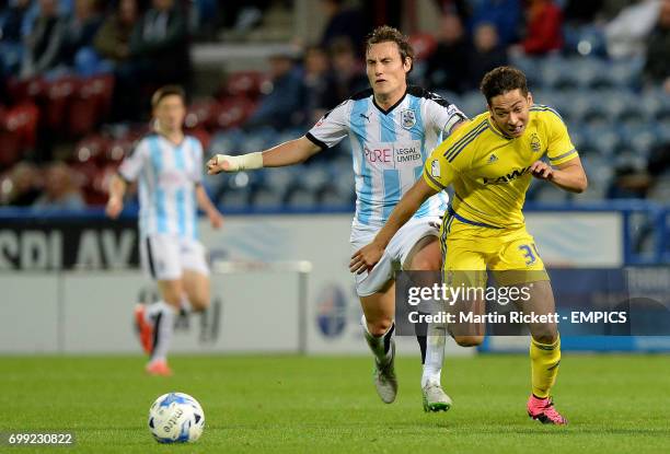 Nottingham Forest's Tyler Walker battles for the ball with Huddersfield Town's Dean Whitehead