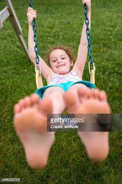 girl swinging on swing - feet girl stock pictures, royalty-free photos & images