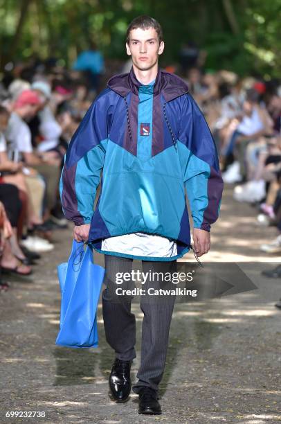 Model walks the runway at the Balenciaga Spring Summer 2018 fashion show during Paris Menswear Fashion Week on June 21, 2017 in Paris, France.