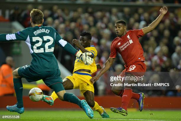 Sion's Ebenezer Assifuah scores past Liverpool's Jordan Ibe and goalkeeper Simon Mignolet