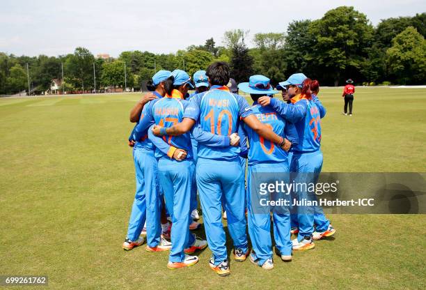 Indian players get in a team huddle as they take to the field during The ICC Women's World Cup warm up match between India and Sri Lanka at Queens...