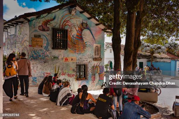 bogota, colombia - local colombian people and a few tourists enjoying the plaza chorro de quevedo - plaza del chorro de quevedo stock pictures, royalty-free photos & images